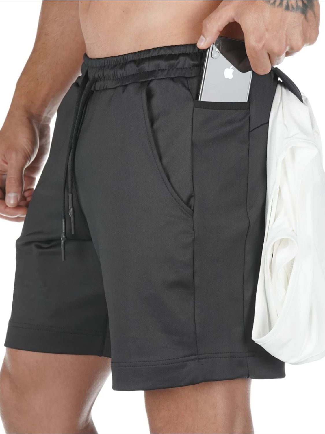 Men's athletic shorts, black front side view, deep side pockets, lightweight polyester blend