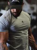 Men's plus size gray gym crew tee with athletic fit and graphic chest detail